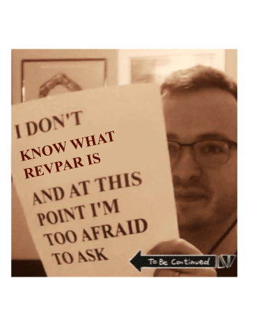 a man holding a papper saying "I don't know what RevPar is"